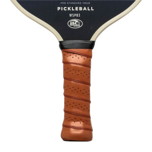 Close-up of a brown pickleball paddle grip with perforations and diagonal wrapping.