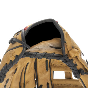 Close-up of tan baseball glove with black lacing, a dark interior, and MADE IN MEXICO stamp.