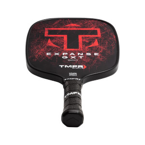 Front view of a black pickleball paddle with red T logo, EXPANSE GXT text, and textured grip.