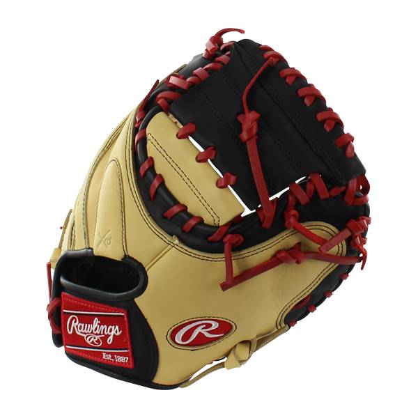 Top-down view of a tan and black catchers mitt with red lacing and Rawlings branding.