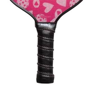 Top-down view of a pink pickleball paddle with a heart pattern and black grip.