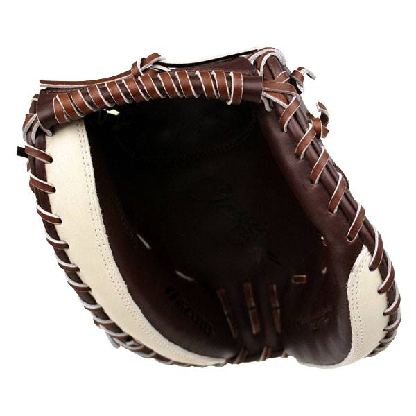 Inside view of a brown and cream catchers mitt with white stitching and visible Mizuno branding.
