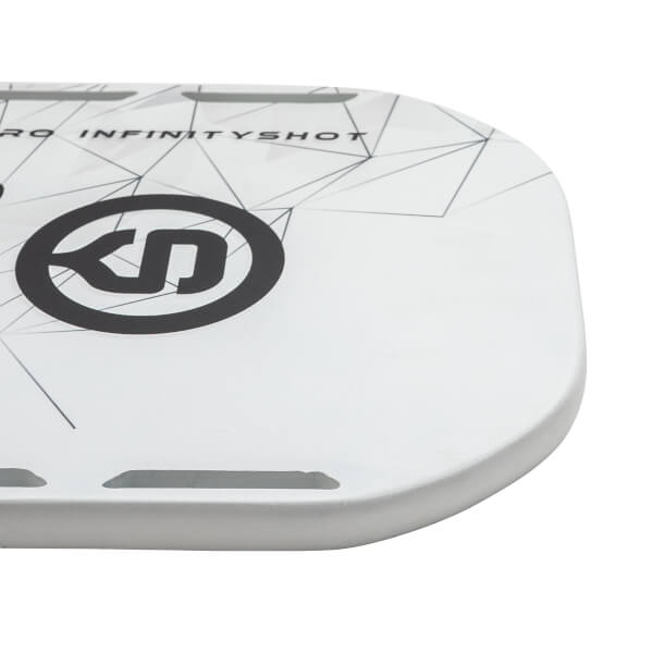 Corner view of a white pickleball paddle with black INFINITYSHOT text and a black logo.