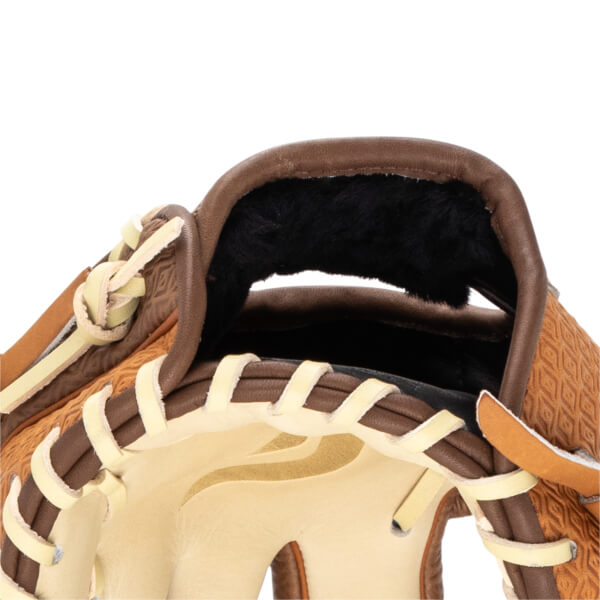 Close-up of the top of a baseball glove, showing tan lacing, brown leather, and a textured pattern.