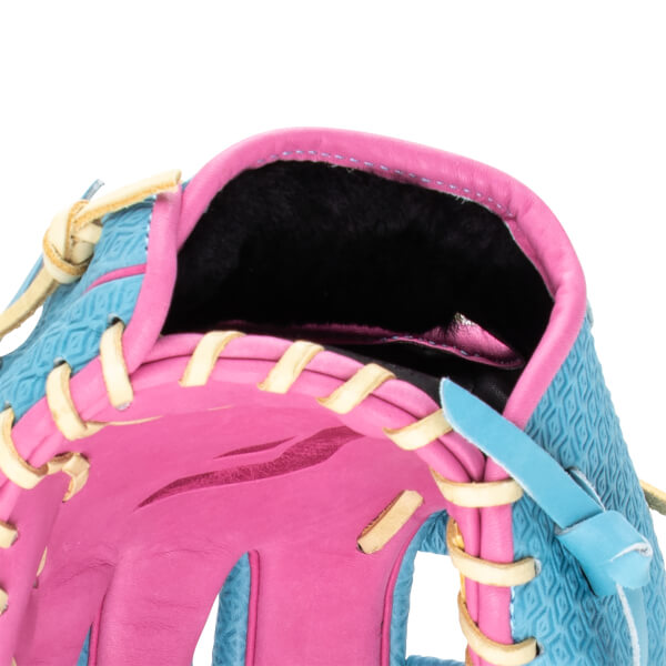 Close-up of a pink and blue baseball glove with tan lacing and a diamond pattern.
