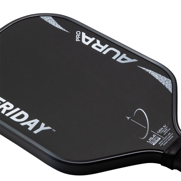 Top-down angled view of a matte black pickleball paddle with silver FRIDAY AURA PRO text and a circular design.