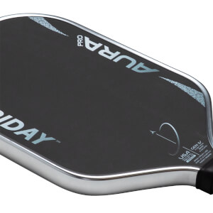 Close-up of a pickleball paddle showing the "PRO AURA" logo and "USA" text.