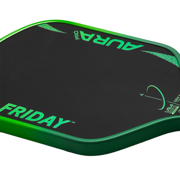 Corner view of a black pickleball paddle with green "FRIDAY" and "PRO AURA" lettering and a green edge.