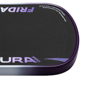 Corner view of a black pickleball paddle with purple "FRIDA" and "AURA PRO" logos, and text "AURA PRO // ENHANCED POWER".