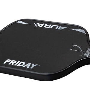 Corner view of the black Friday Aura Pro paddle, showing white "FRIDAY" logo and "AURA PRO" text with speckles.