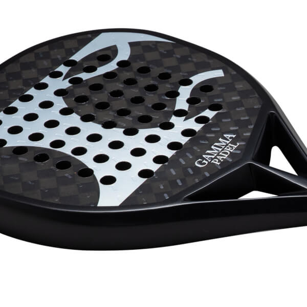 Close-up of a black padel racket face with a checkered pattern, circular holes, and "GAMMA PADEL" text.