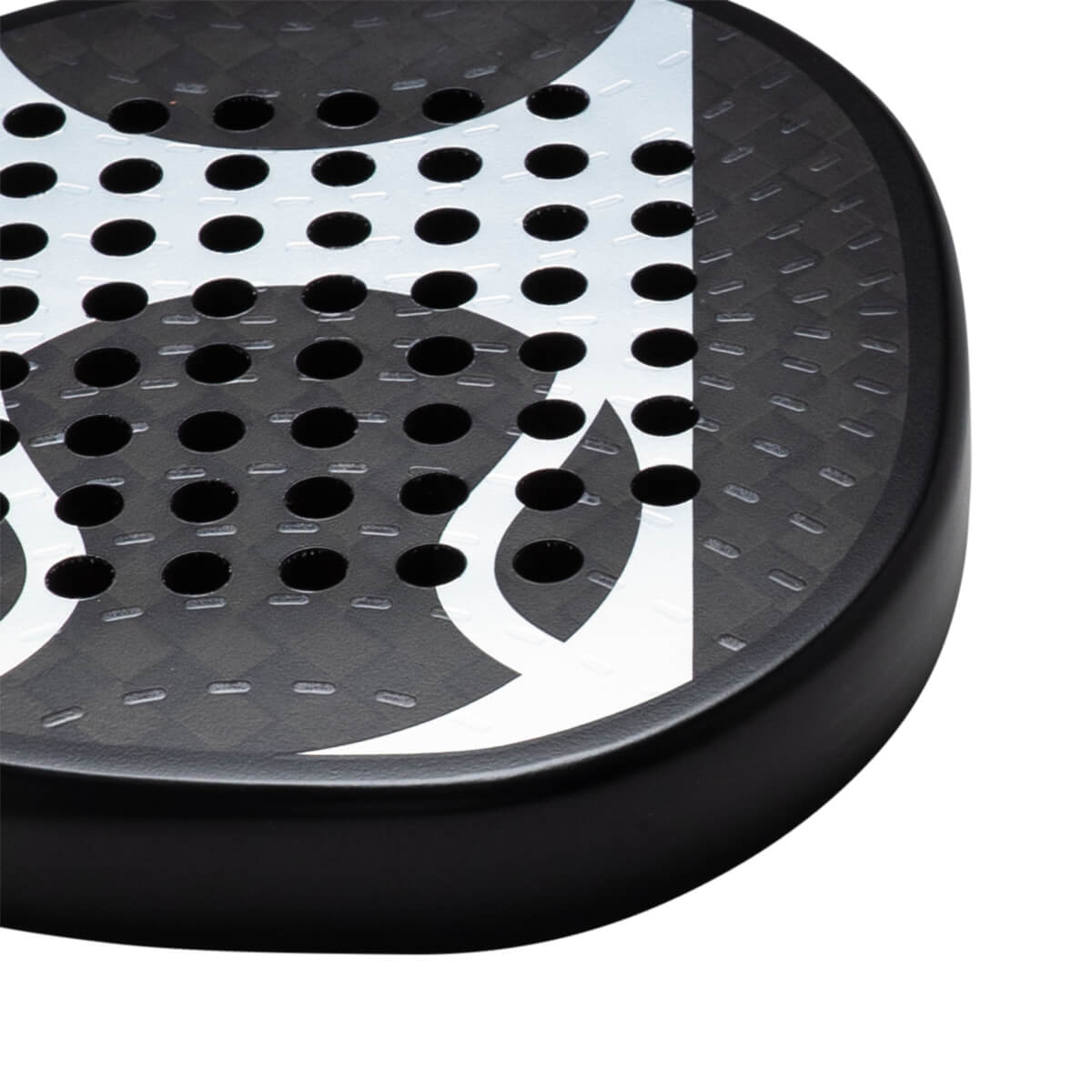 Corner view of a black paddle with white abstract design and circular holes.