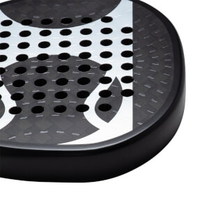 Corner view of a black paddle with white abstract design and circular holes.