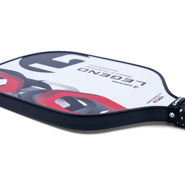 Side view of a white GAMMA Legend pickleball paddle with red and black abstract graphics and a black grip.