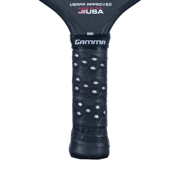 Close-up of a black pickleball paddle grip with honeycomb texture and GAMMA branding.