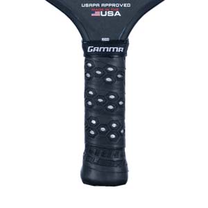 Close-up of a black pickleball paddle grip with honeycomb texture and GAMMA branding.