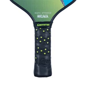 Close-up of a black pickleball paddle grip with honeycomb texture and GAMMA PICKLE text.
