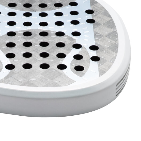 Corner view of a white paddle with a grey textured surface and black circular holes.
