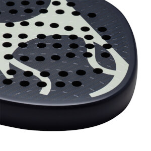 Corner view of a dark blue padel racket with a white abstract design and circular holes.