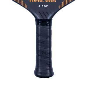 Close-up of a black pickleball paddle handle with GEARBOX branding and 8.5OZ text.
