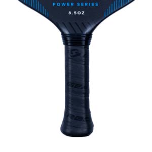 Close-up of a black pickleball paddle grip with GEARBOX text and POWER SERIES 8.5OZ on the paddle head.