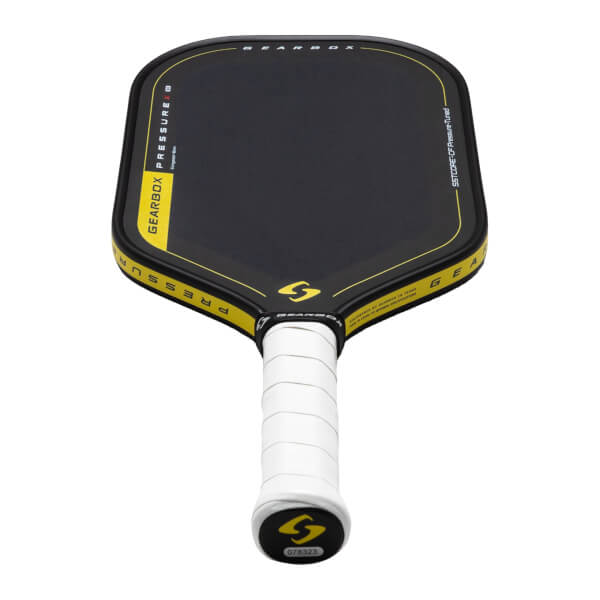 Top-down view of a black pickleball paddle with yellow trim, showing "GEARBOX PRESSURE" and a yellow "S" logo.