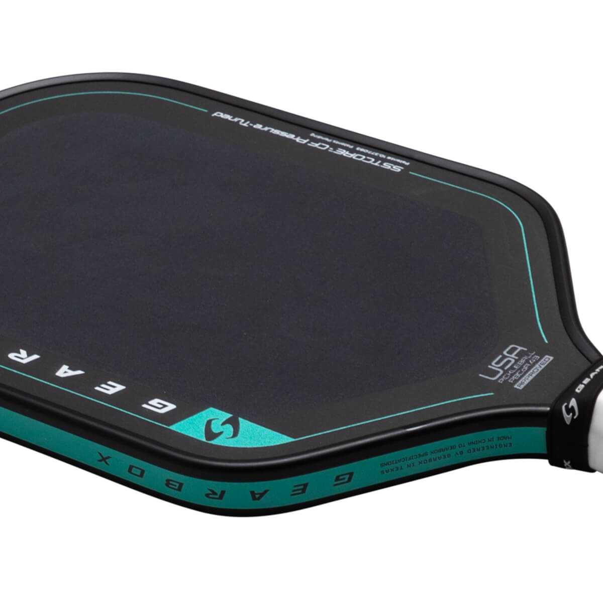 Close-up of a black pickleball paddle with a teal border, showing "GEARBOX" and "USA PICKLEBALL APPROVED" text.