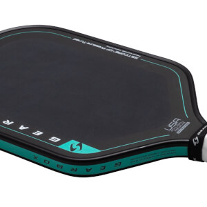 Close-up of a black pickleball paddle with a teal border, showing "GEARBOX" and "USA PICKLEBALL APPROVED" text.
