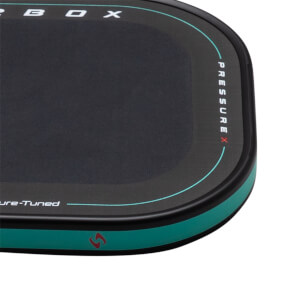 Corner view of a black product with white text "PRESSURE X" and "ure-Tuned" and a teal accent stripe.