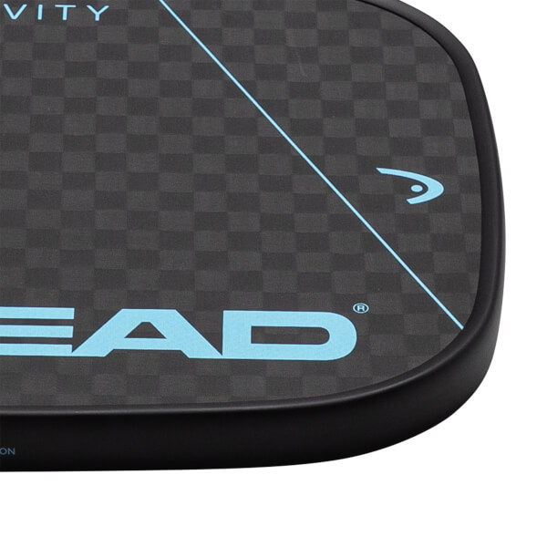 Corner view of a black pickleball paddle with a checkered pattern, a blue HEAD logo, and a blue diagonal line.