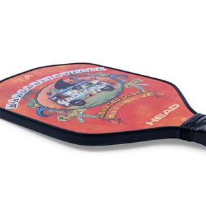 Side view of a red pickleball paddle with a Margaritaville graphic and HEAD logo.
