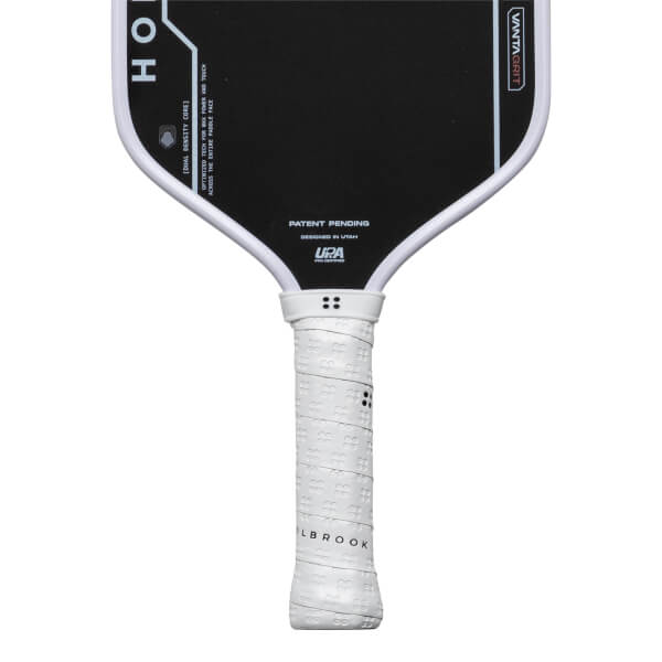 Top-down view of a pickleball paddle showing the "HO" logo, "VANTAGGRIT" text, and white grip with "OLBROOK" text.