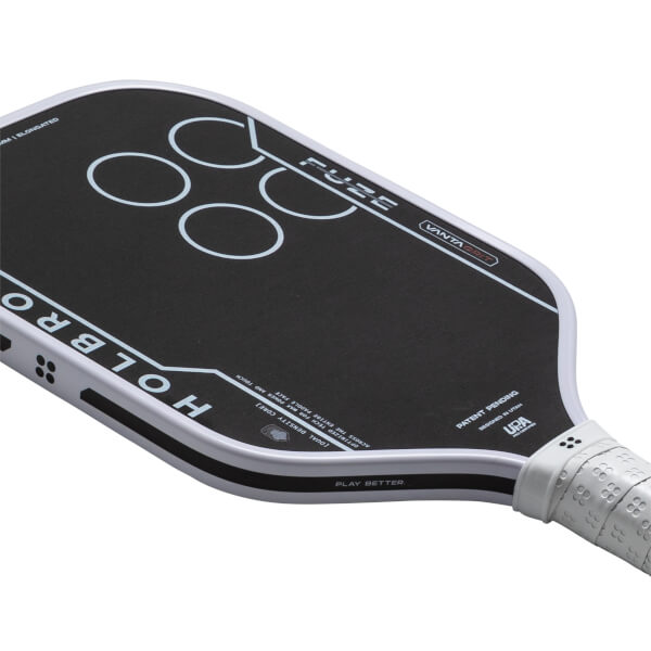 Top-down view of a black pickleball paddle with white text "HOLBRO" and "FUZE", and four white circles.