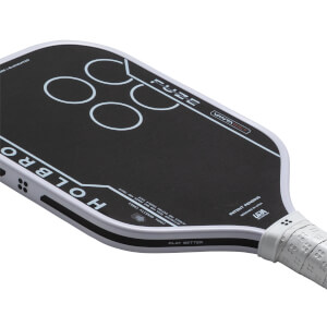Top-down view of a black pickleball paddle with white text "HOLBRO" and "FUZE", and four white circles.