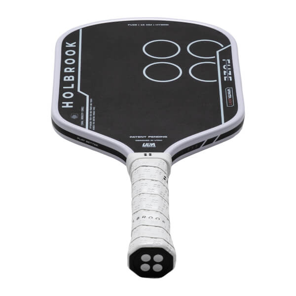 Top-down view of a black pickleball paddle with white "HOLBROOK" text, four white circles, and "FUZE | 16 MM | HYBRID" text.