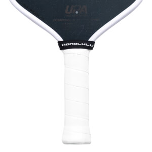 Close-up of the white-wrapped handle and lower paddle face featuring the URA logo and a black rubber neck band with the word HONOLULU in white text.