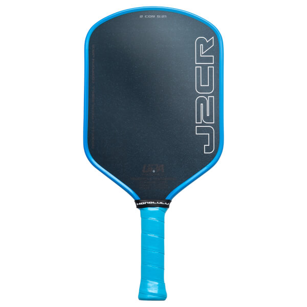 Front view of a black pickleball paddle with a blue edge guard and grip, featuring "J2CR" text on the face and "HONOLULU" on the throat.