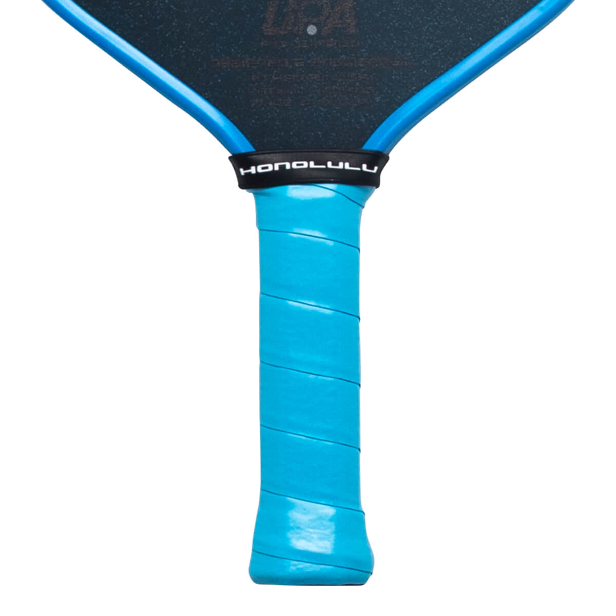 Close-up view of a pickleball paddle handle featuring a light blue grip wrap and a black throat band with "HONOLULU" in white text.