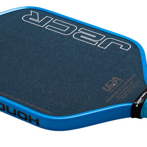 Close-up angled view of a pickleball paddle with a blue edge, "HONOLULU" branding, and a dark textured face featuring large white "J2K" outlines and a "UPA" logo.
