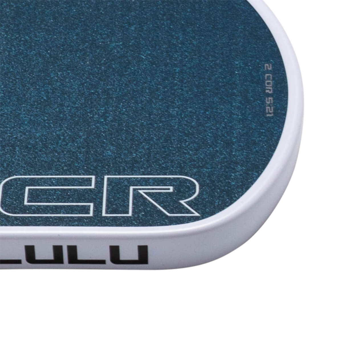 Close-up of a blue speckled surface with white text "CR" and "LULU" visible.