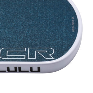 Close-up of a blue speckled surface with white text "CR" and "LULU" visible.