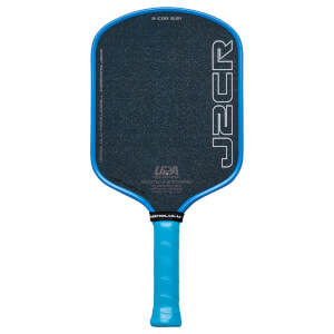 Front view of a blue and black pickleball paddle with "J2CR" and "HONOLULU" visible.