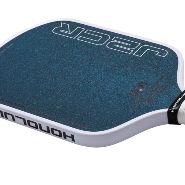Corner view of a blue pickleball paddle with white "JCR" and "HONOLULU" text.