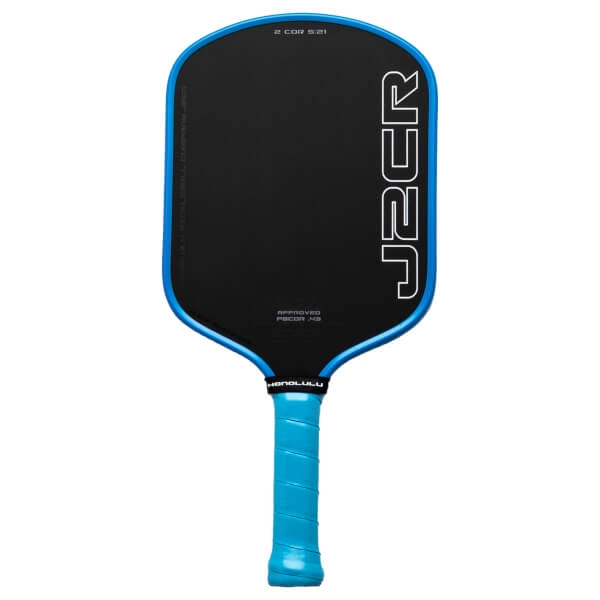 Front view of a black pickleball paddle with a blue rim, featuring white "J2CR" lettering and "HONOLULU" text.