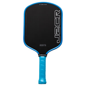 Front view of a black pickleball paddle with a blue rim, featuring white "J2CR" lettering and "HONOLULU" text.