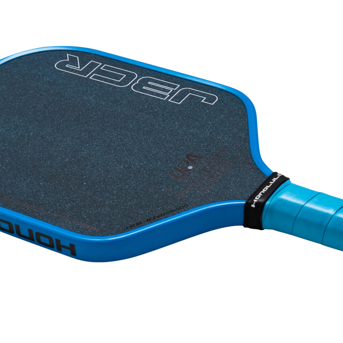 Corner view of a blue pickleball paddle with a textured dark blue hitting surface, showing the "J3CR" logo and "HONOLULU" on the grip.