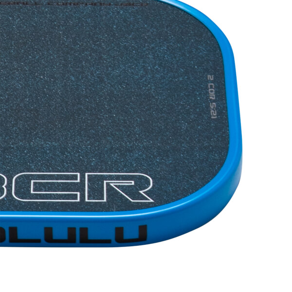 Corner view of a blue paddle with a textured dark blue surface and white text reading "BER" and "LULU".