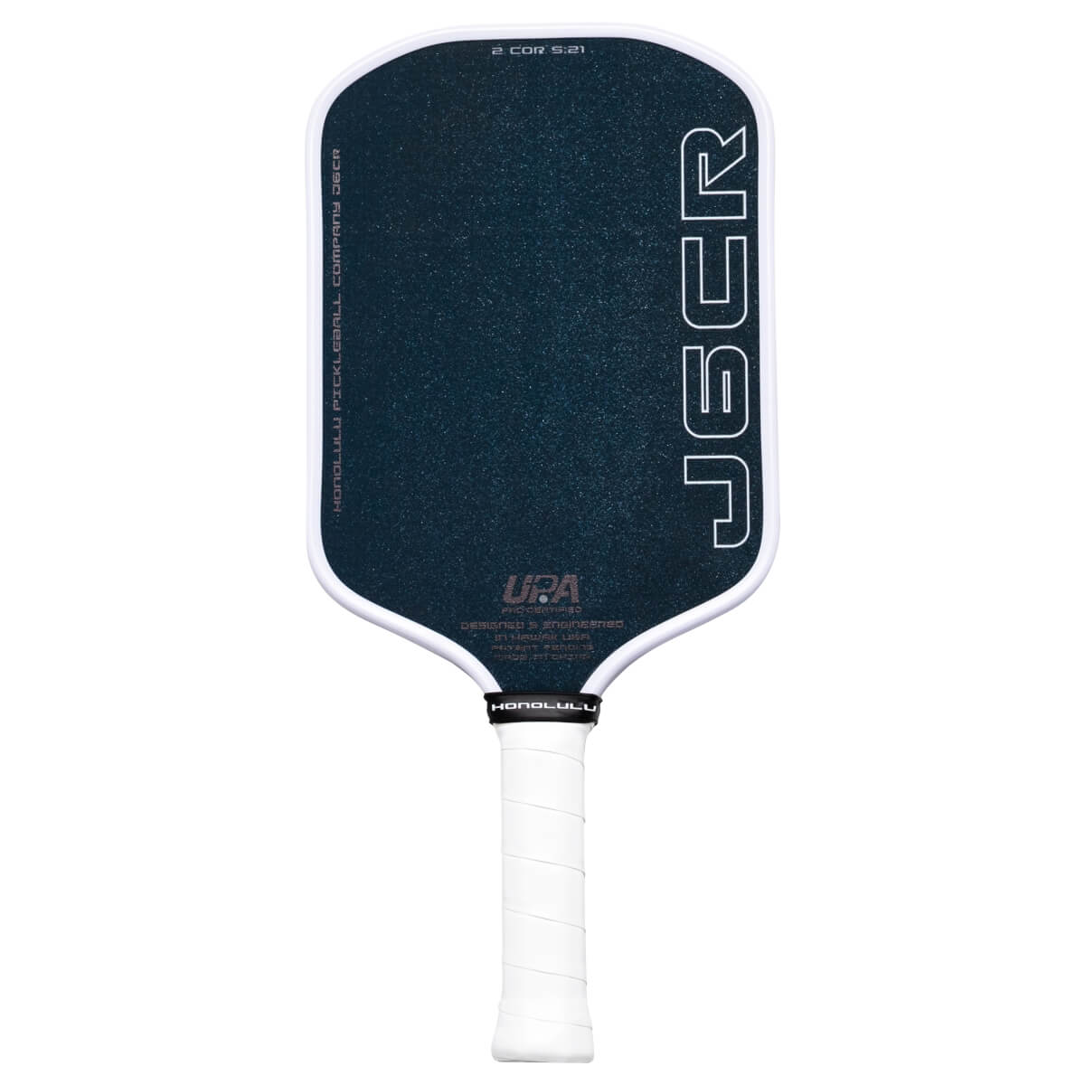 Front view of a dark blue pickleball paddle with white trim, featuring "JBCR" and "HONOLULU" text.
