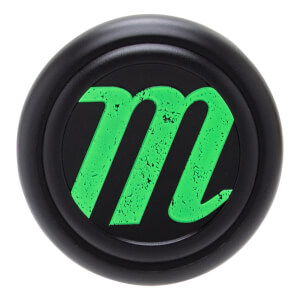 Close-up of a black and green baseball bat end cap with a circular design and a textured green Marucci M logo.