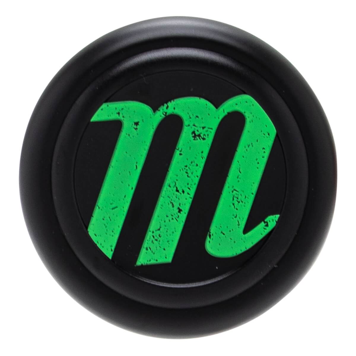 Top-down view of a black baseball bat end cap with a textured green Marucci m logo and a subtle raised rim.